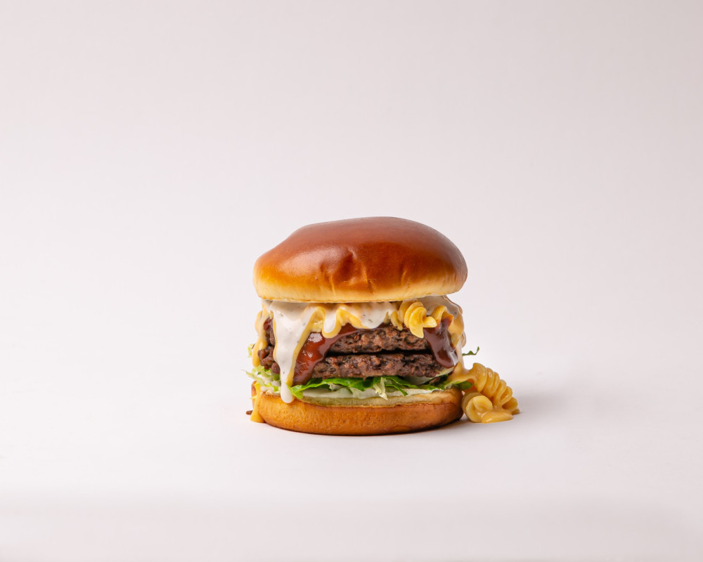 Veggie Grill’s Limited Edition Double BBQ Mac Burger is Double Stacked and Full of Mac & Cheese